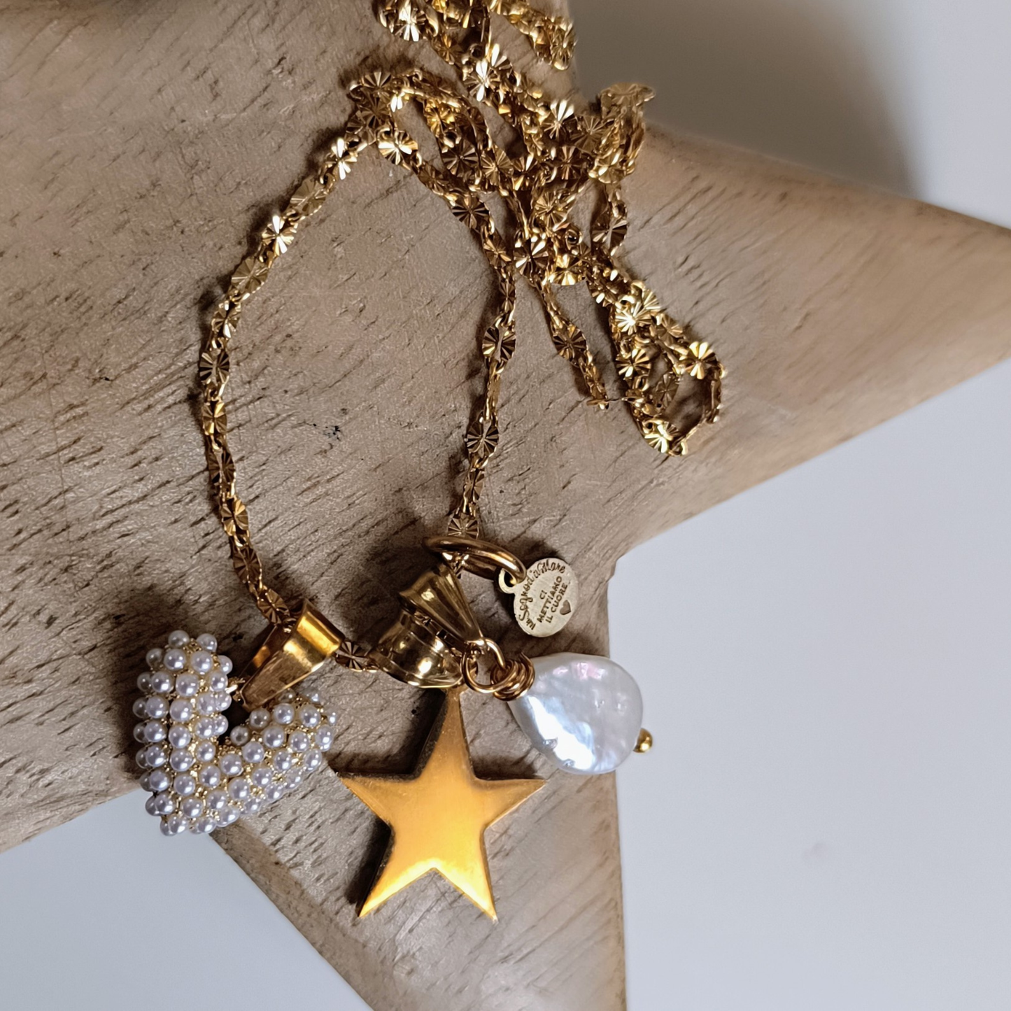 Collana con cuore in perle, stella e perla naturale